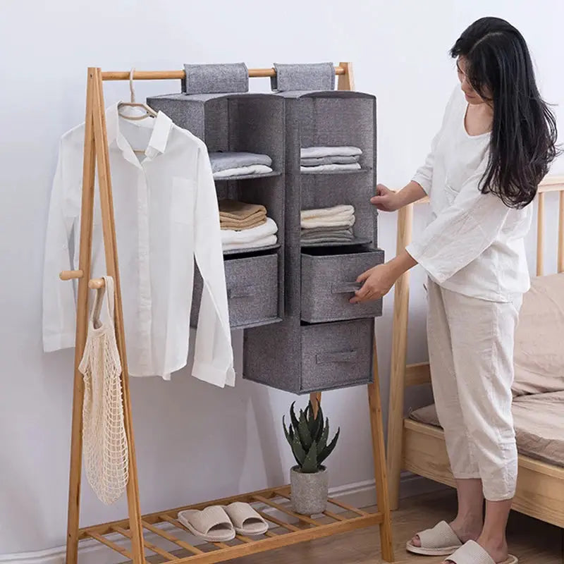 Cotton-linen hanging wardrobe organizer in gray, two-column drawer-style storage on a wooden clothes rack Simples Market