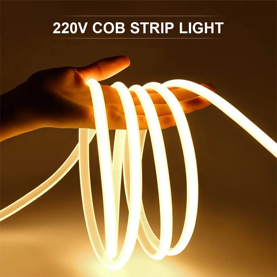 220V COB LED strip light, warm-white flexible tape held in hand