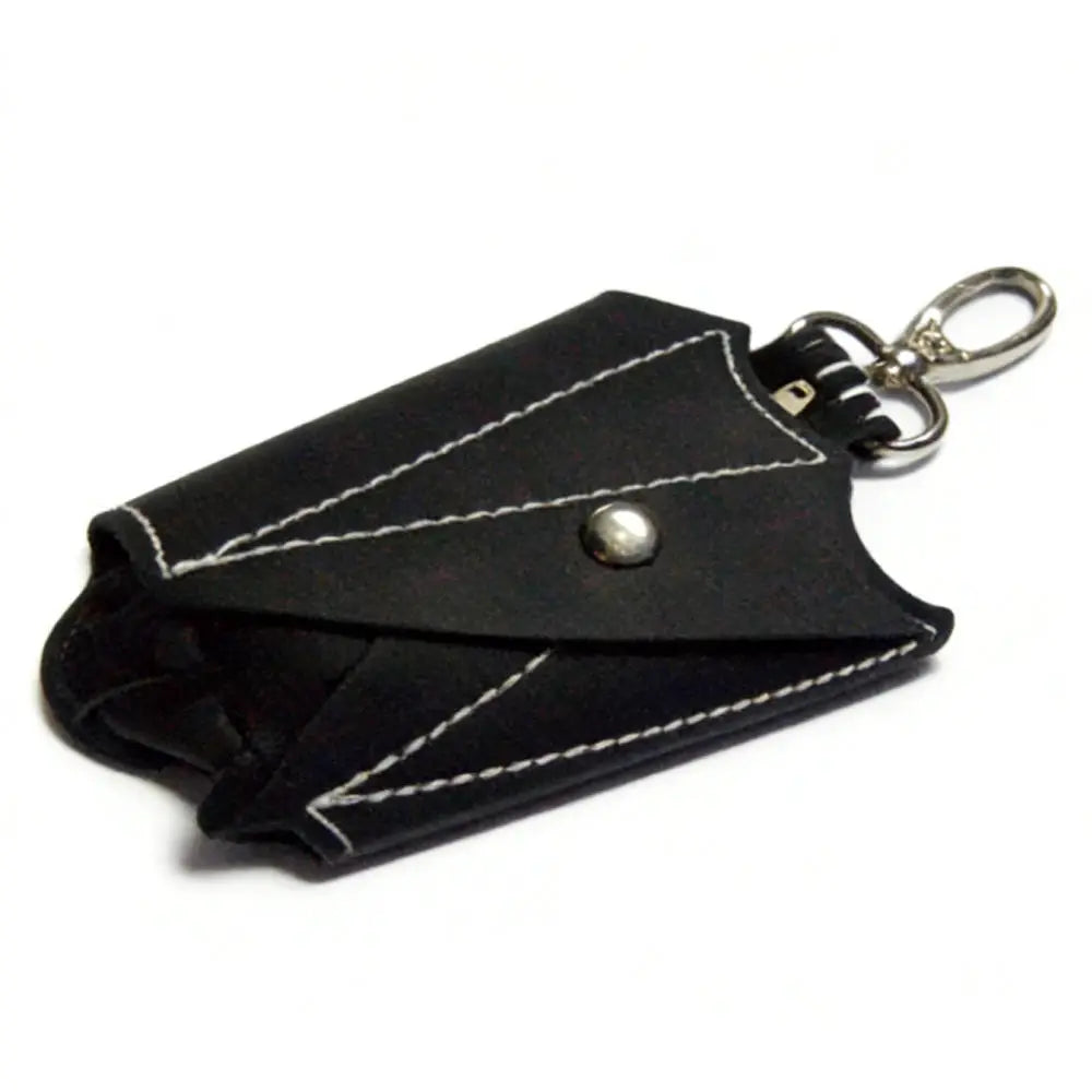 Bat-shaped black PU leather coin purse with foldable wings and keychain attachment.