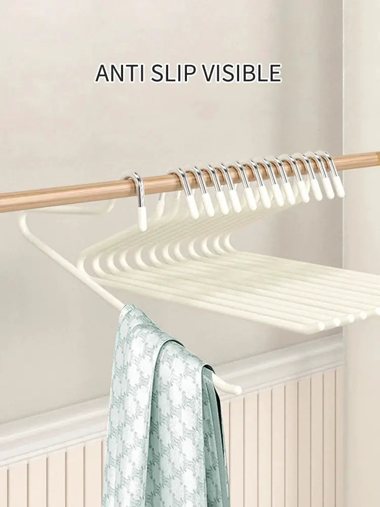 30pcs goose-shaped anti-slip pants hangers on a wooden rod, white.