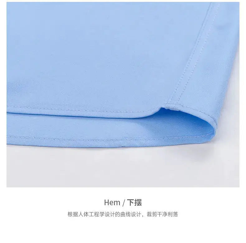 Men's light blue long-sleeve dress shirt hem with curved edge, smooth fabric.