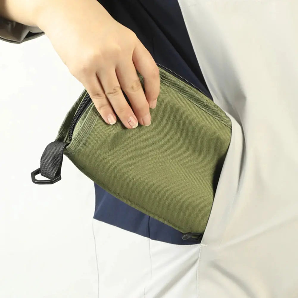 Simples Market folding stool in olive-green carry pouch tucked into a pocket