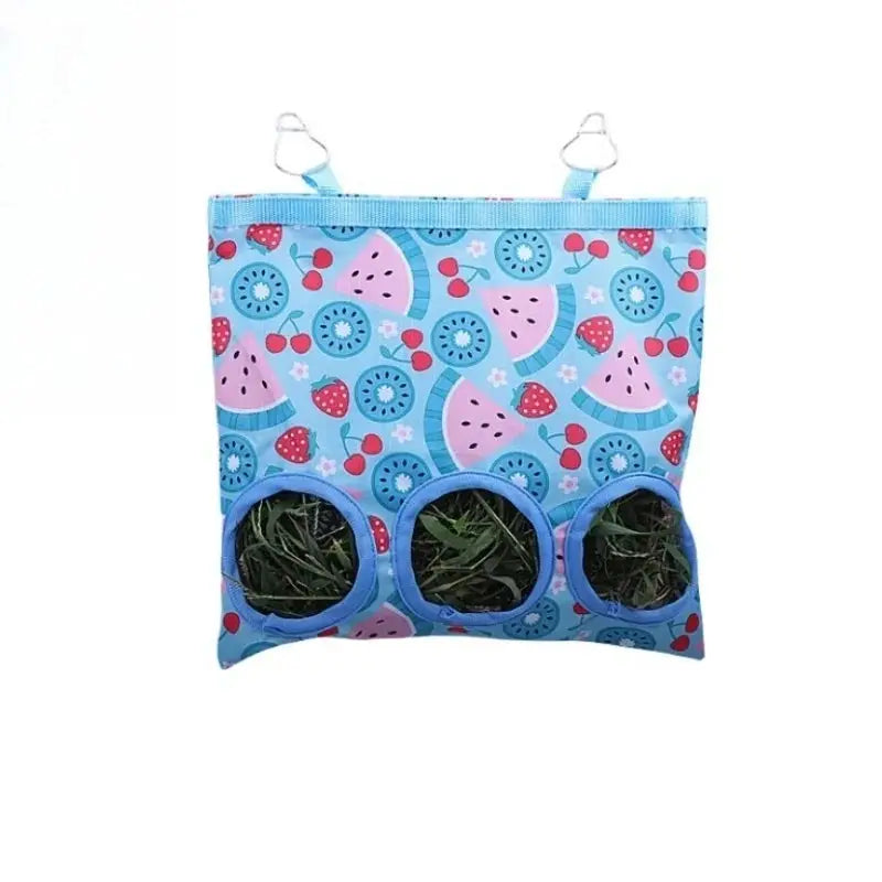Simples Market Rabbit Hay Bag hanging feeder, blue fruit-pattern fabric with 2/3 holes