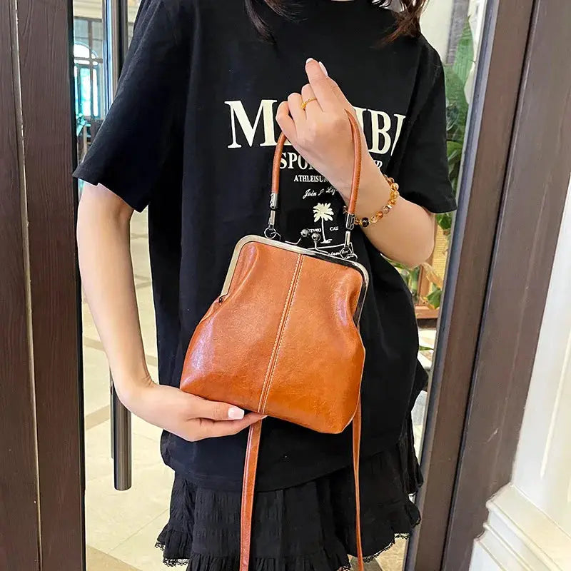 Simples Market brown PU leather vintage-style handbag with metal frame, short top handle and crossbody strap