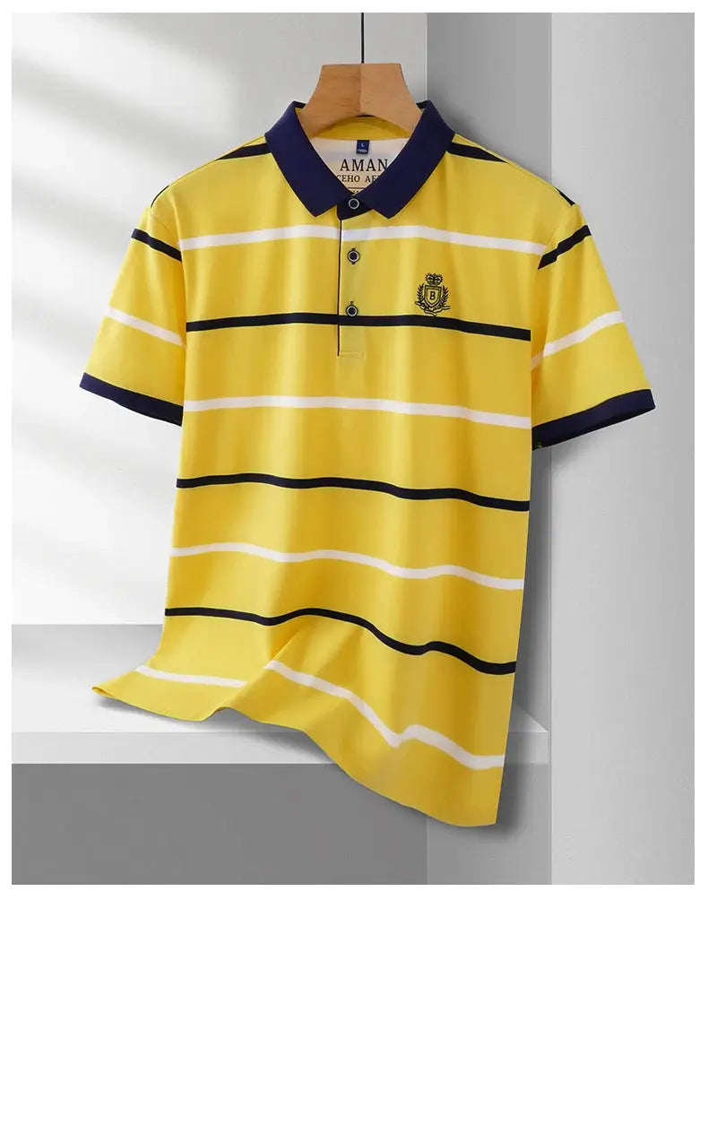 Men's polo shirt in yellow with navy collar and horizontal white and dark stripes; chest embroidered crest