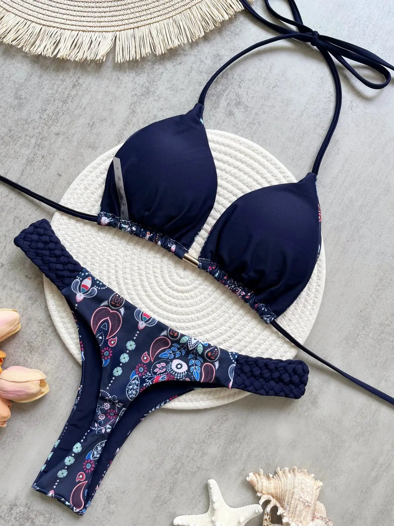 Two-piece navy halter bikini set with floral-print high-cut bottoms