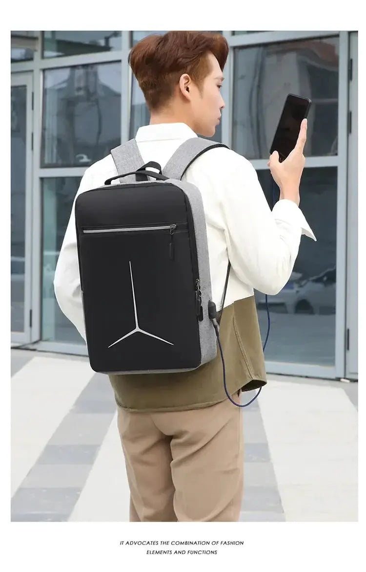 Anti-theft laptop backpack with gray EVA shell and black front panel.