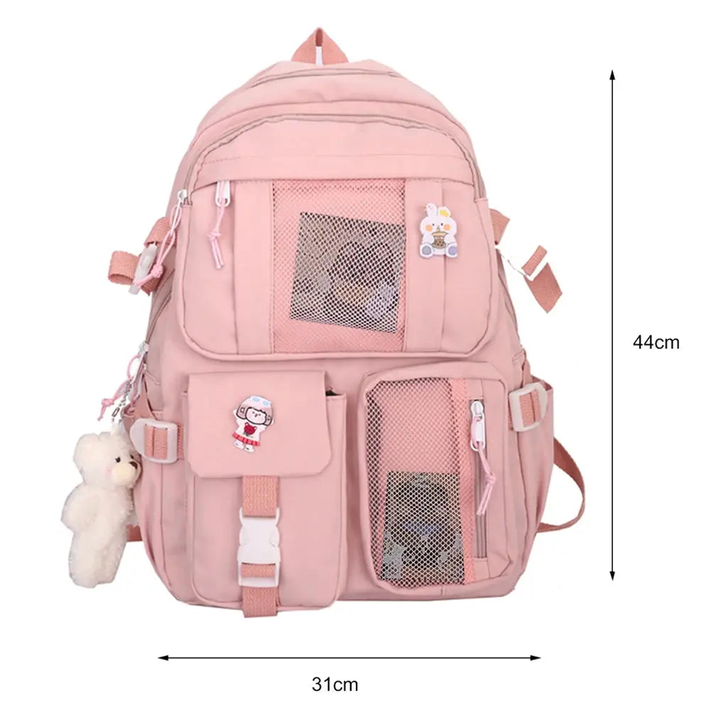 Simples Market pink school backpack with multiple pockets and mesh panels, plush keychain