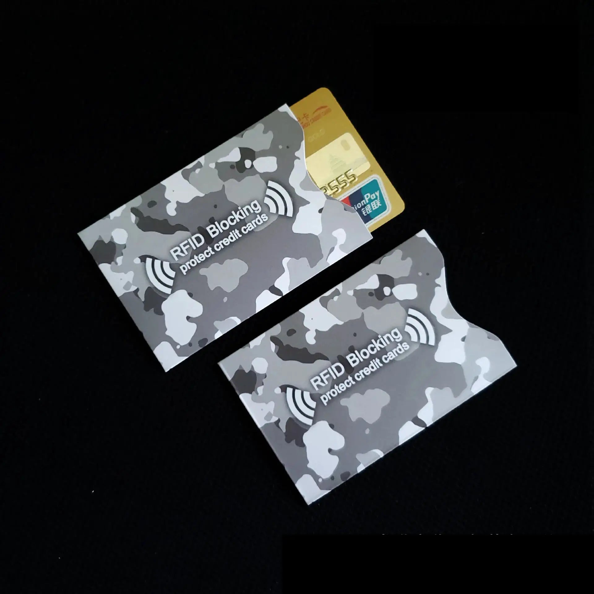 3-pack RFID blocking cards in gray camouflage design on black background