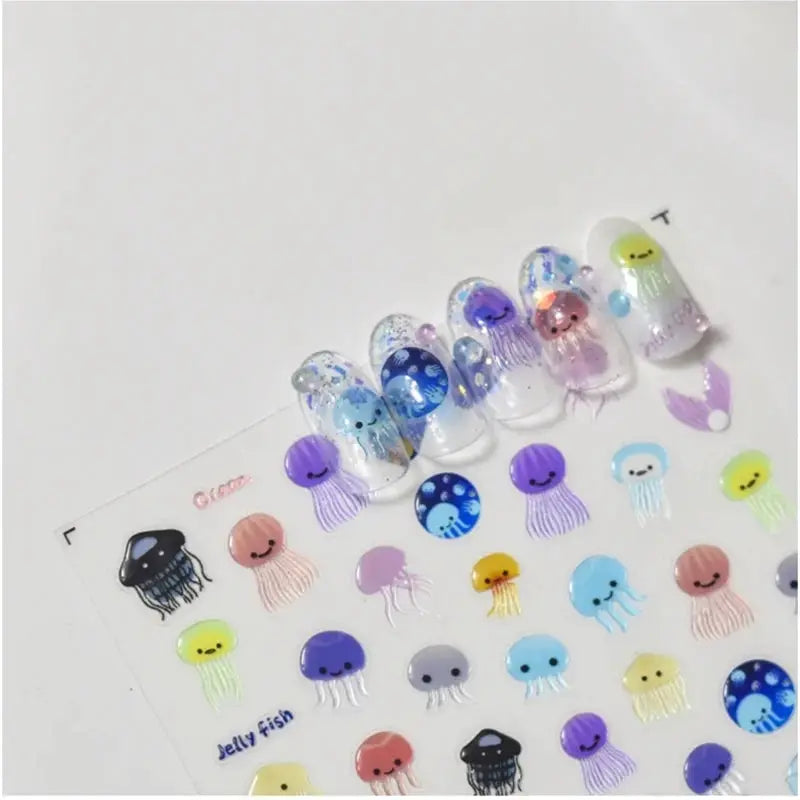 Jellyfish nail art stickers by Simples Market; 5D kawaii self-adhesive decals in multiple colors on a clear sheet.
