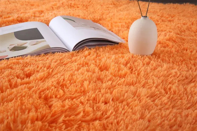Premium fluffy area rug by Simples Market in orange shag, ultra-soft living room carpet.