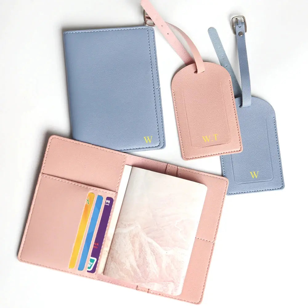4-piece travel passport cover set in pastel pink and blue with passport holders, luggage tags and card slots