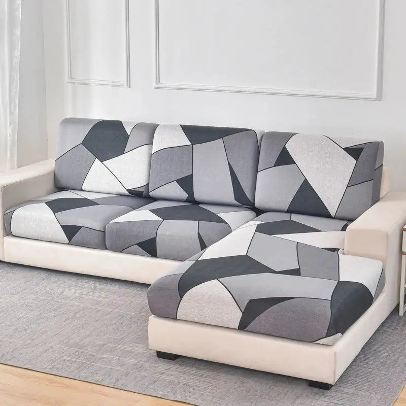 L-shaped sofa slipcover set with geometric grey, black and white cushions for couch and chaise
