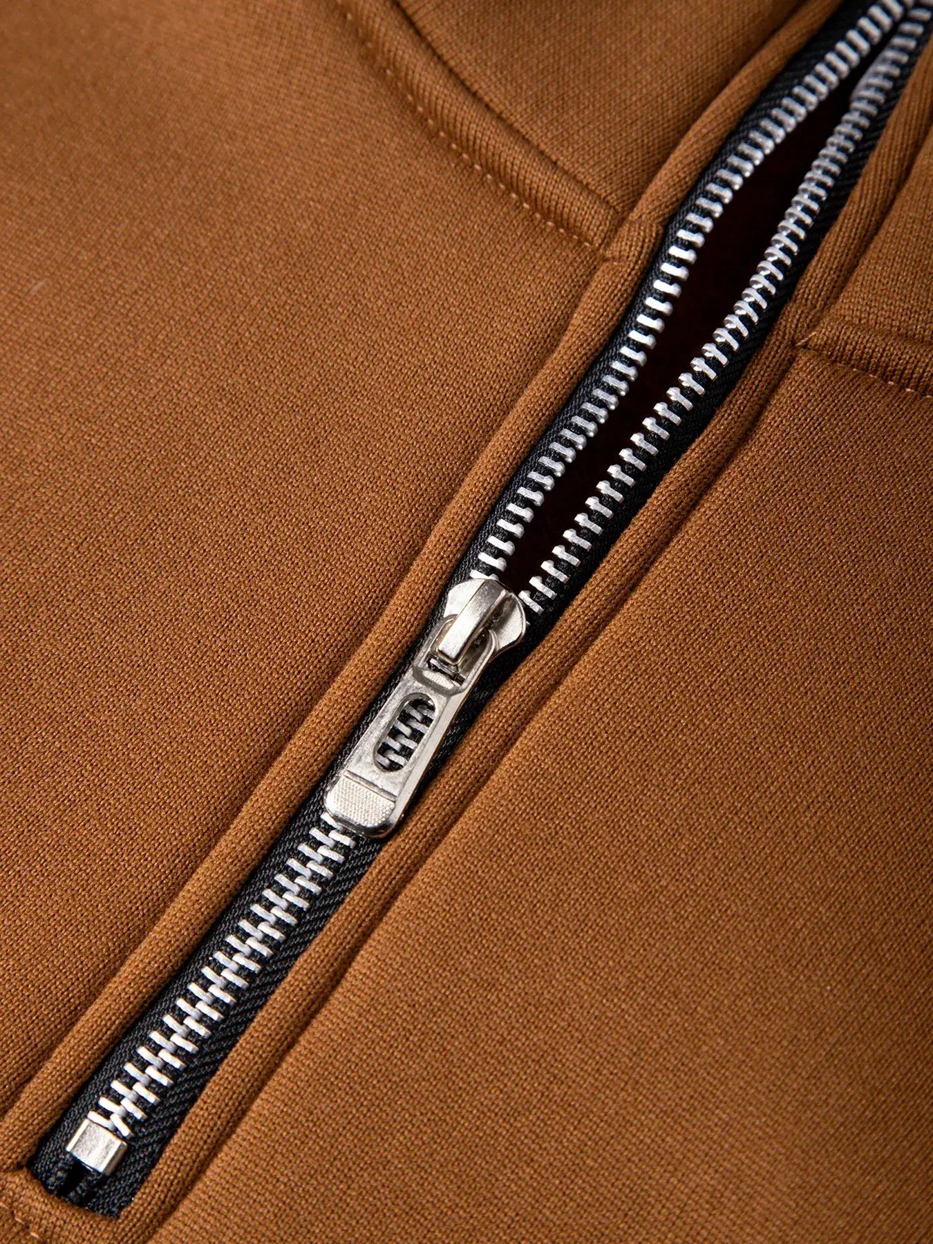 Brown men's zip-up pullover sweater with a metal zipper on knit fabric.