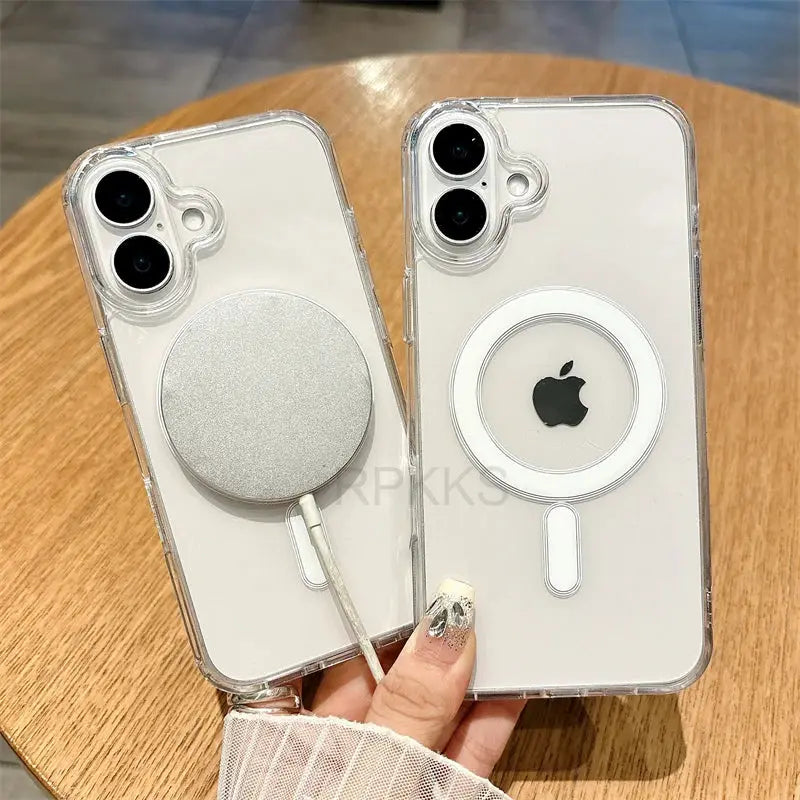 Two clear MagSafe iPhone cases by Simples Market with circular charging discs