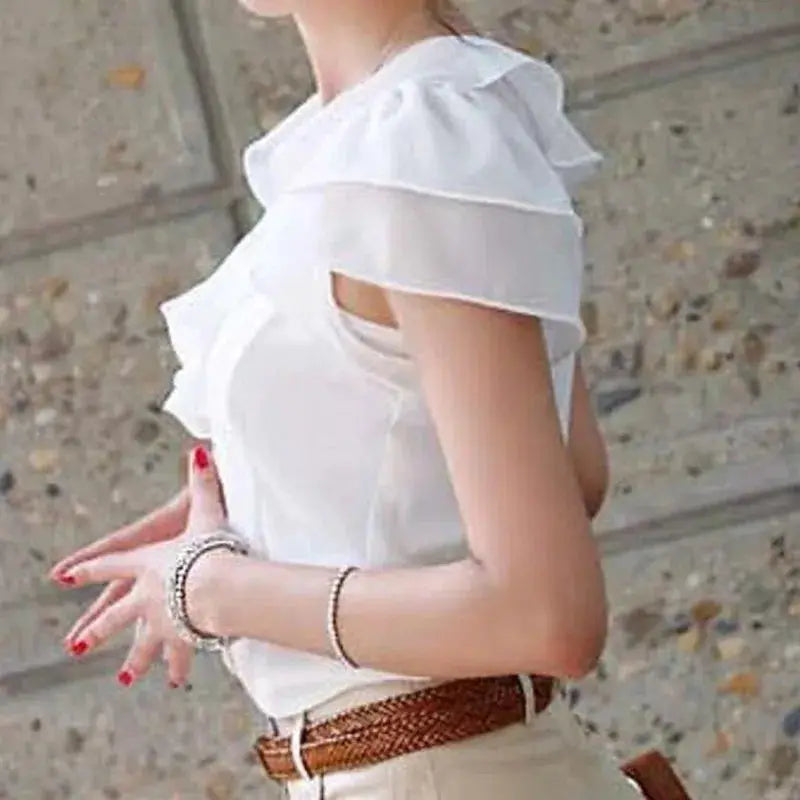 White blouse by Simples Market with ruffle front and short cold-shoulder sleeves