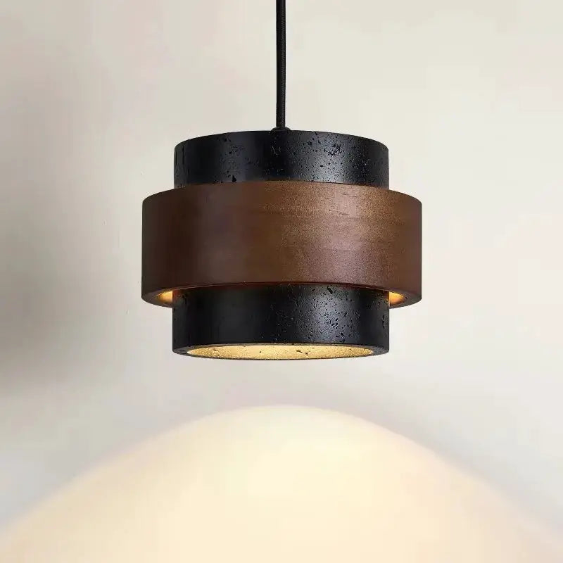 Bar pendant lamp in black and brown wood-like bands, wabi-sabi inspired, warm glow.
