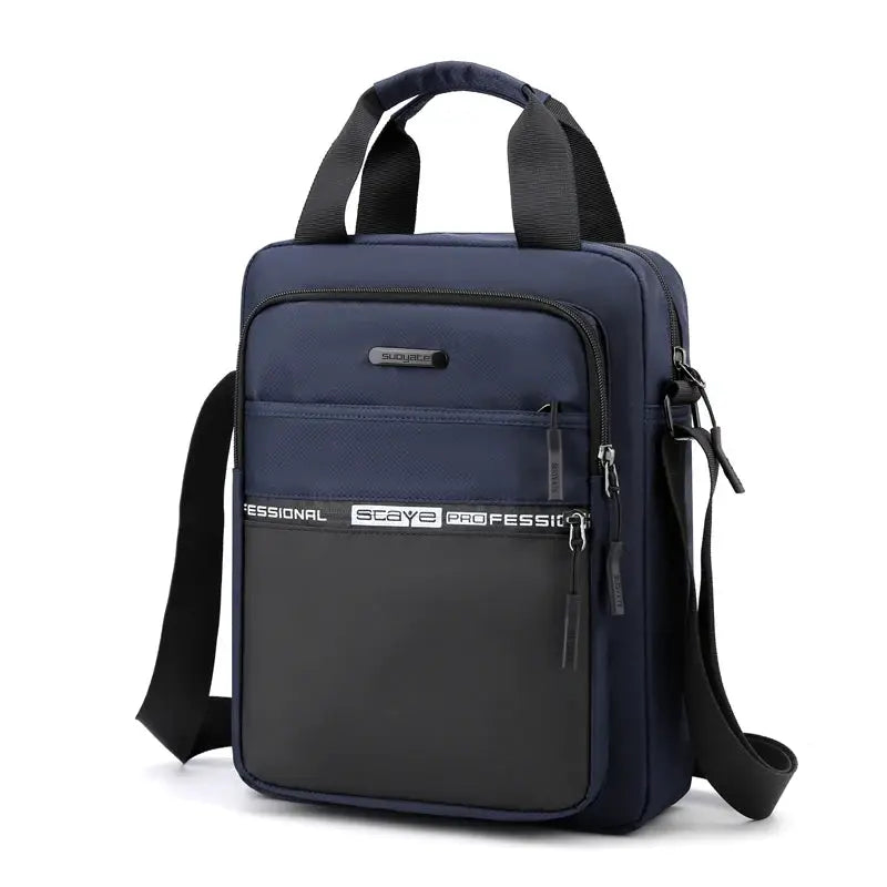 Men's navy crossbody bag with adjustable shoulder strap and black front pocket, multiple zip compartments.