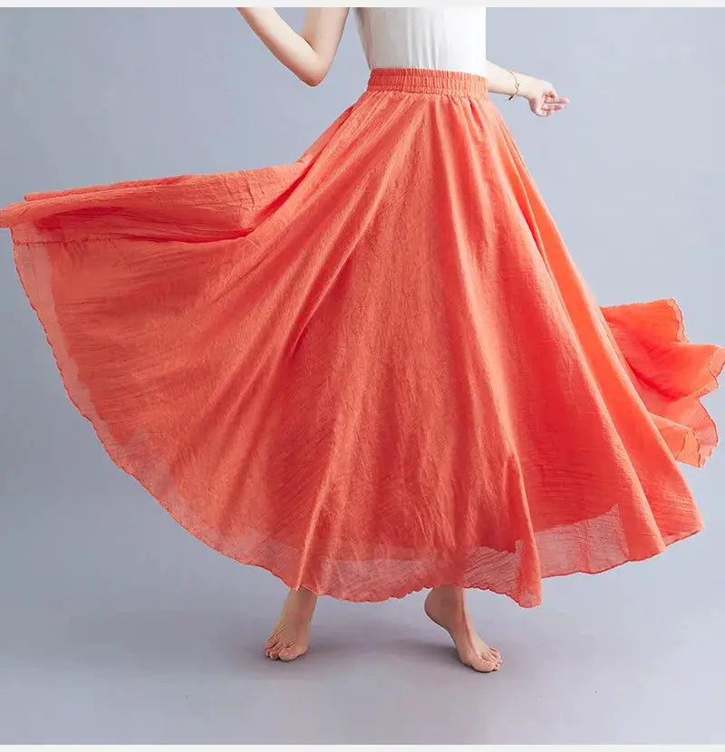 Simples Market Mori-style cotton-linen maxi skirt in coral orange with elastic waist and flowing A-line.