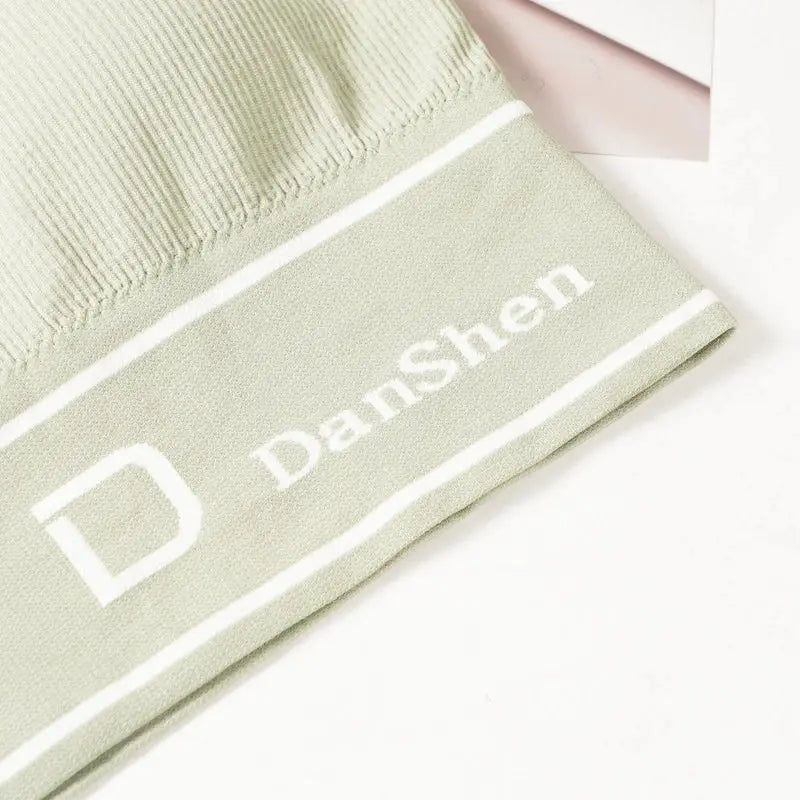 Sports bra mint green seamless wireless full-coverage with Danshen logo on fabric