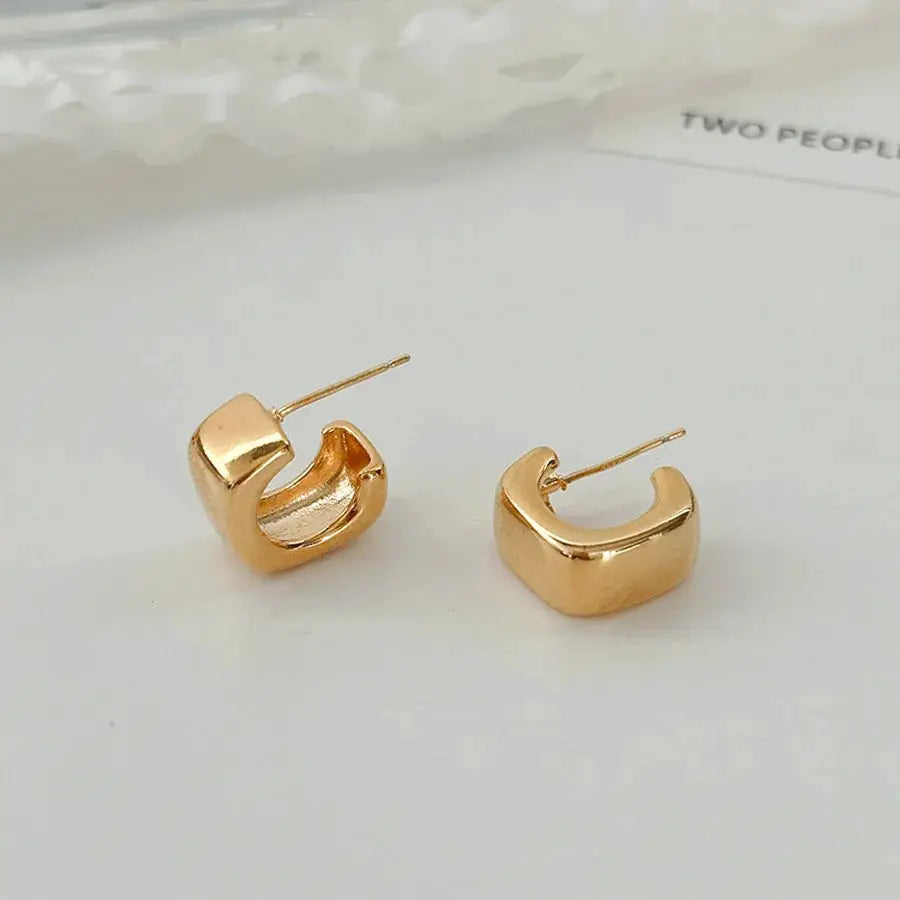 Gold-tone irregular oval earrings with posts; unisex geometric style pair