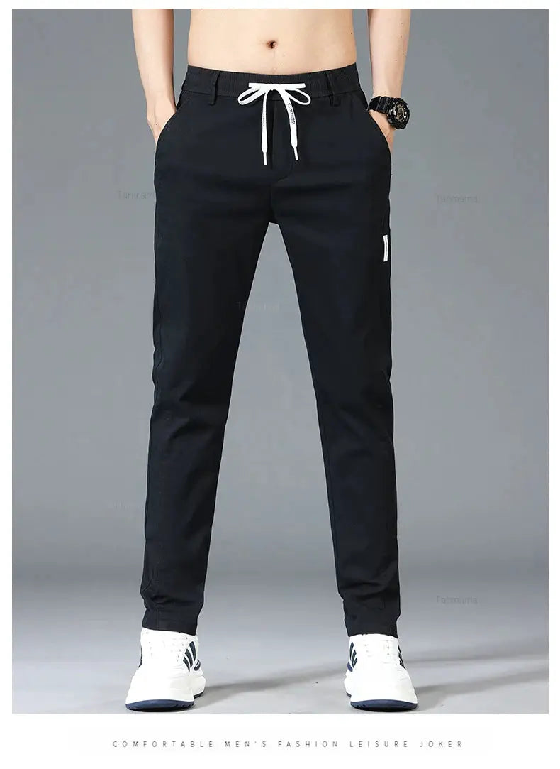 Men's spring/summer casual pants by Simples Market with elastic drawstring waist, black slim-straight trousers.