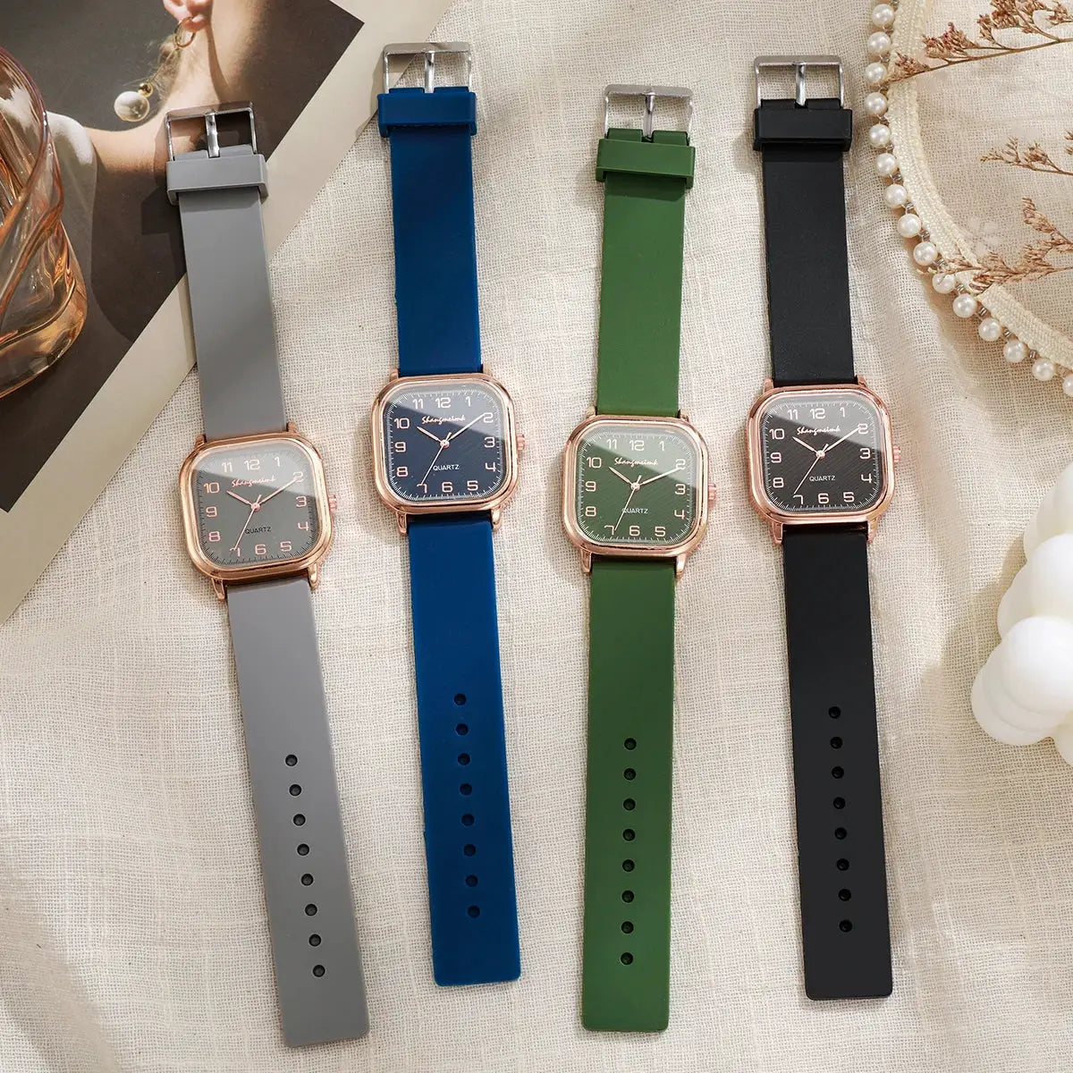 Square-faced women's quartz watches set with silicone straps in gray, blue, green, and black (4 watches)