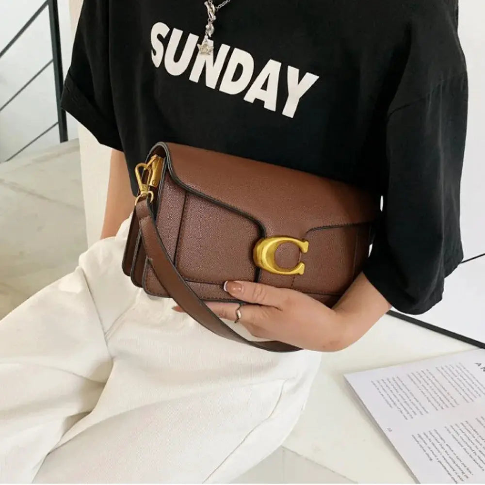 Double-Strap Small Square Crossbody Bag in brown textured leather with gold-tone hardware and adjustable strap.