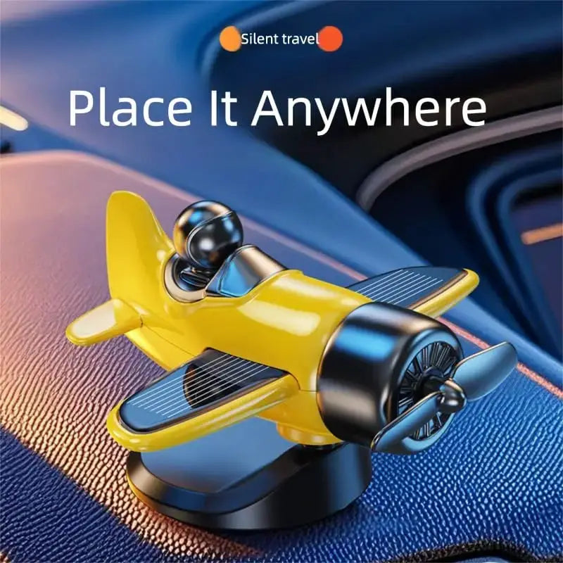 Solar powered rotating airplane car dashboard ornament in yellow with 360° spin