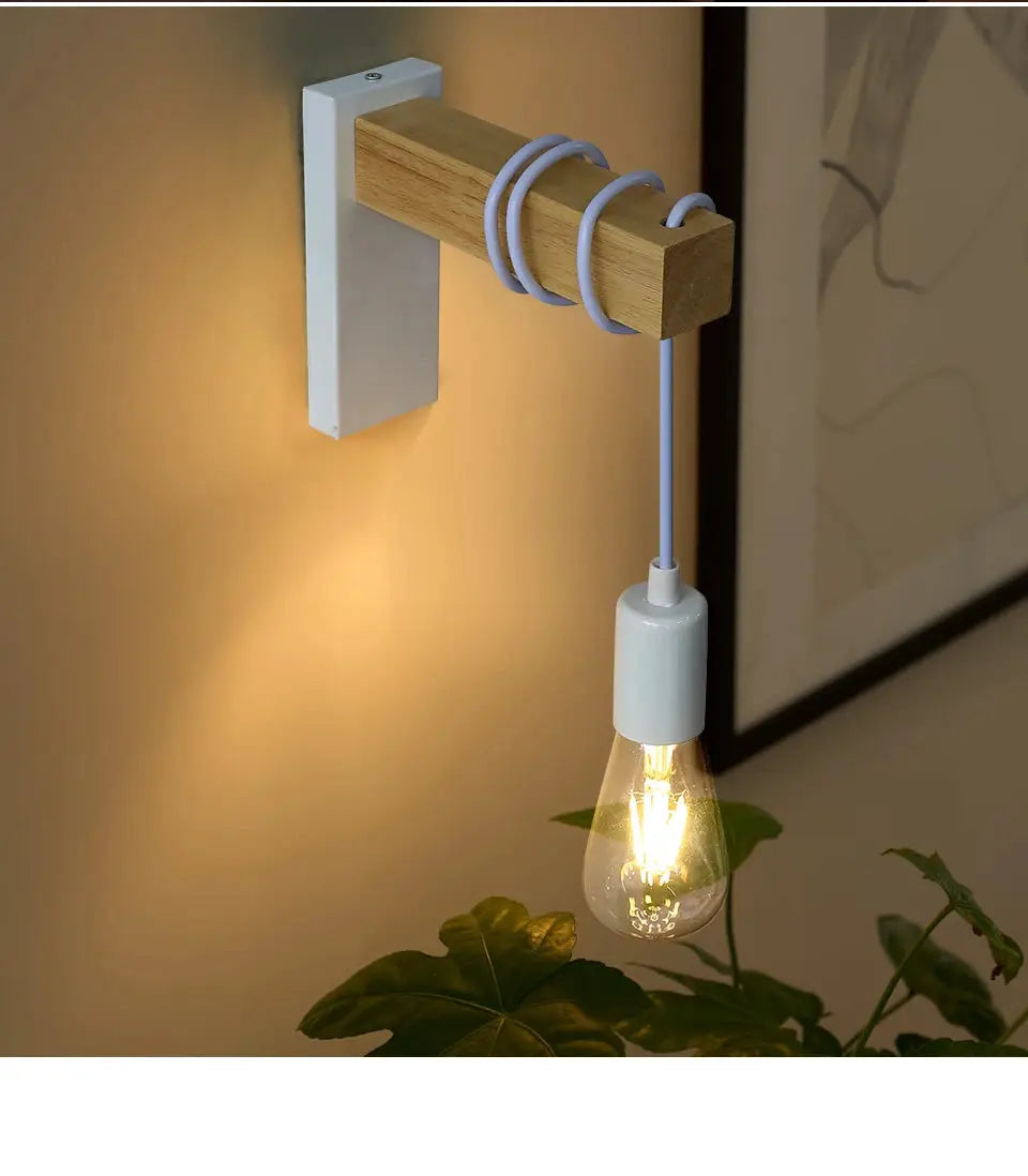 Wooden wall lamp with white metal mount, blue cord, and exposed Edison bulb