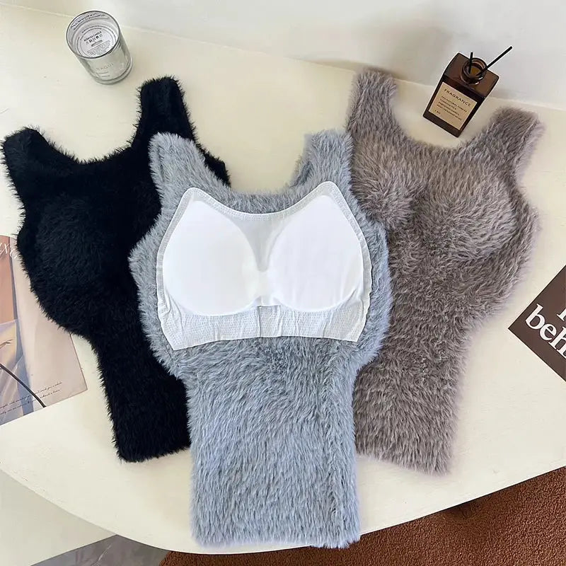 Three plush fleece tank tops in black, gray and beige; gray one includes a white bra pad