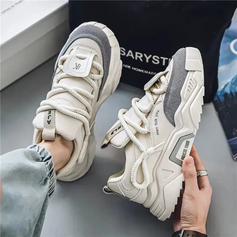 Men's casual sports shoes by Simples Market, cream with gray accents, chunky soles, pair shown.