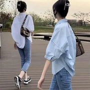 Women's light-blue oversized summer shirt blouse; mid-sleeve, casual Y2K style by Simples Market, shown on two models.