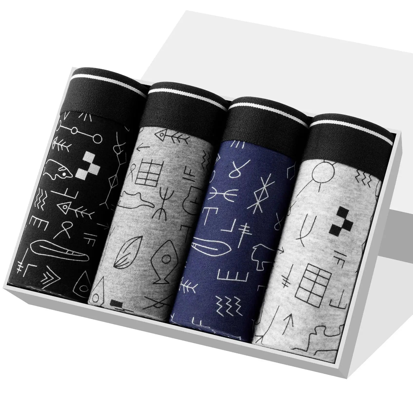Set of 4 cotton men's boxer shorts in black, gray, blue and light gray with abstract white patterns, neatly rolled in a box.