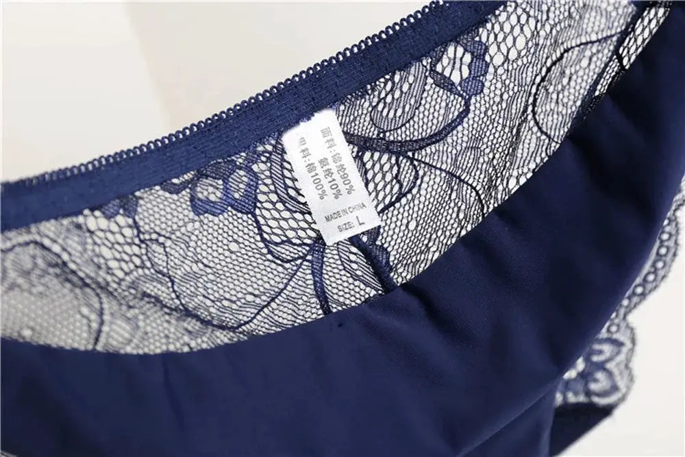 Navy blue lace panties with floral mesh pattern, low-rise seamless design.