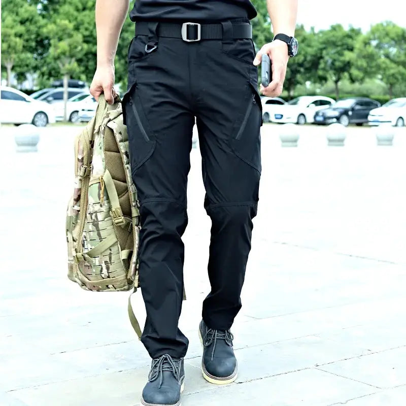 Military tactical cargo pants for men in black with multi-pocket design; waterproof and wear-resistant for hiking.
