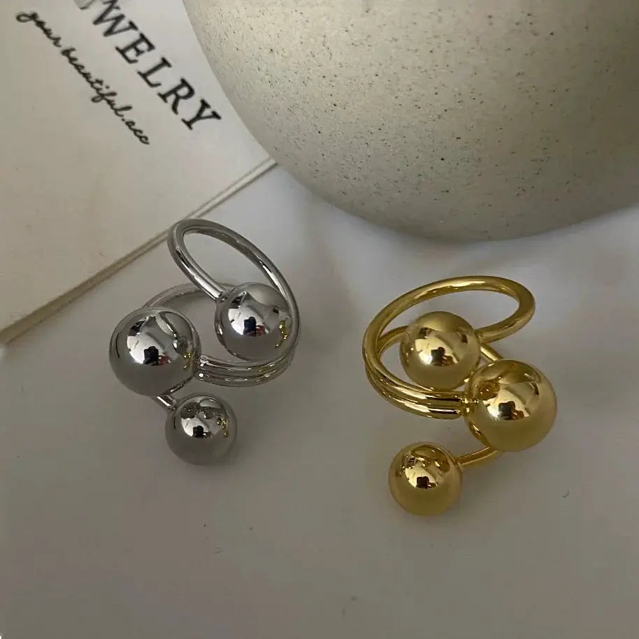 Exaggeration Punk Metal Ring Set for Women, irregular three-ball design, adjustable; two-color silver and gold-tone.