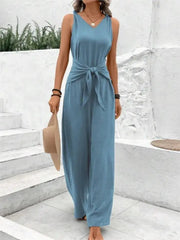 Simples Market blue sleeveless V-neck jumpsuit with waist-tie belt and wide-leg pants.