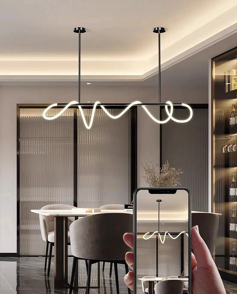 Nordic pendant light from Simples Market with white looping LED over dining room table