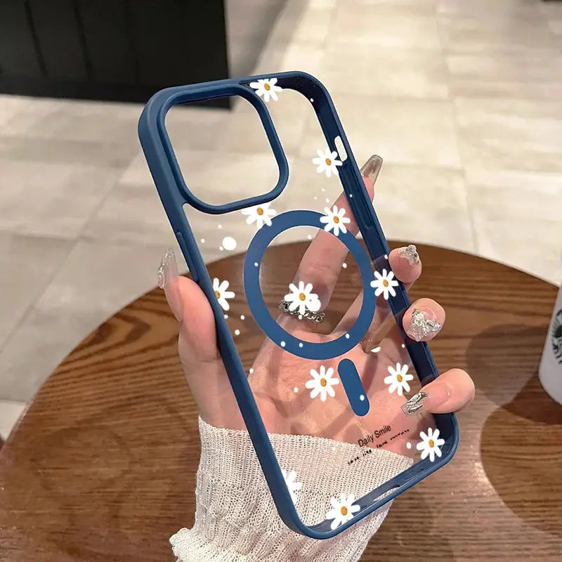 iPhone case with clear back and blue bumper featuring a small daisy pattern; magnetic and wireless charging compatible