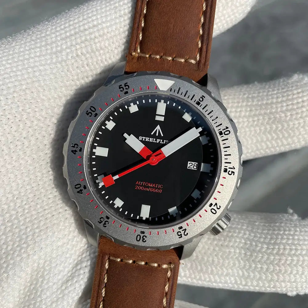 STEELFLIER SF752 automatic dive watch with black dial, red hands, 200m, silver bezel, brown leather strap.