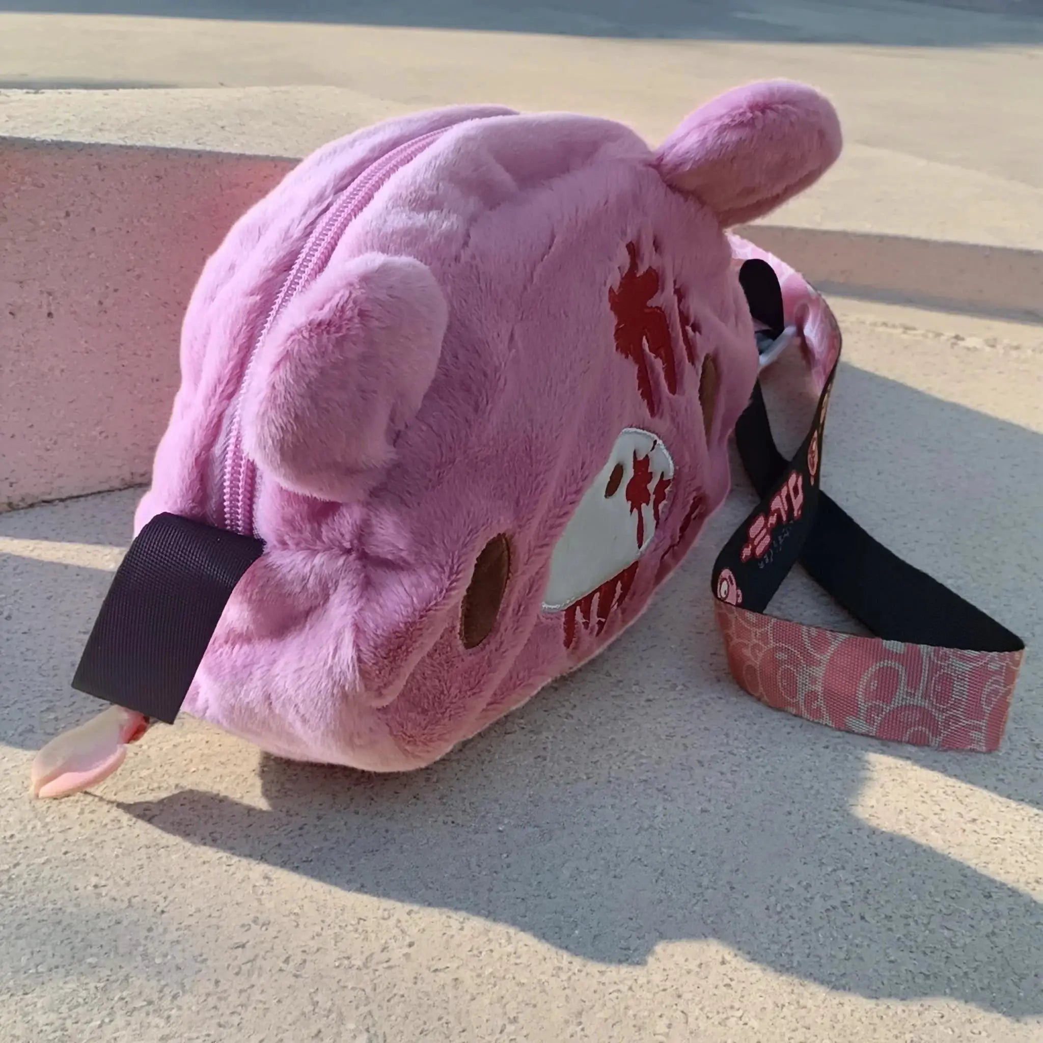 Gloomy Bear plush crossbody bag, pink with red blood-splatter details and black strap