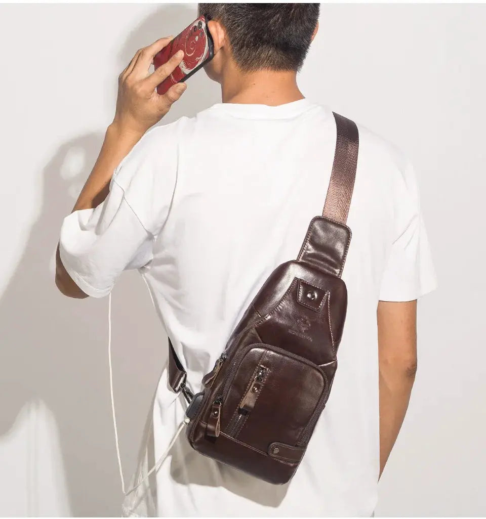 HUMERPAUL men's USB chest bag in brown genuine leather, crossbody with front zip pocket.