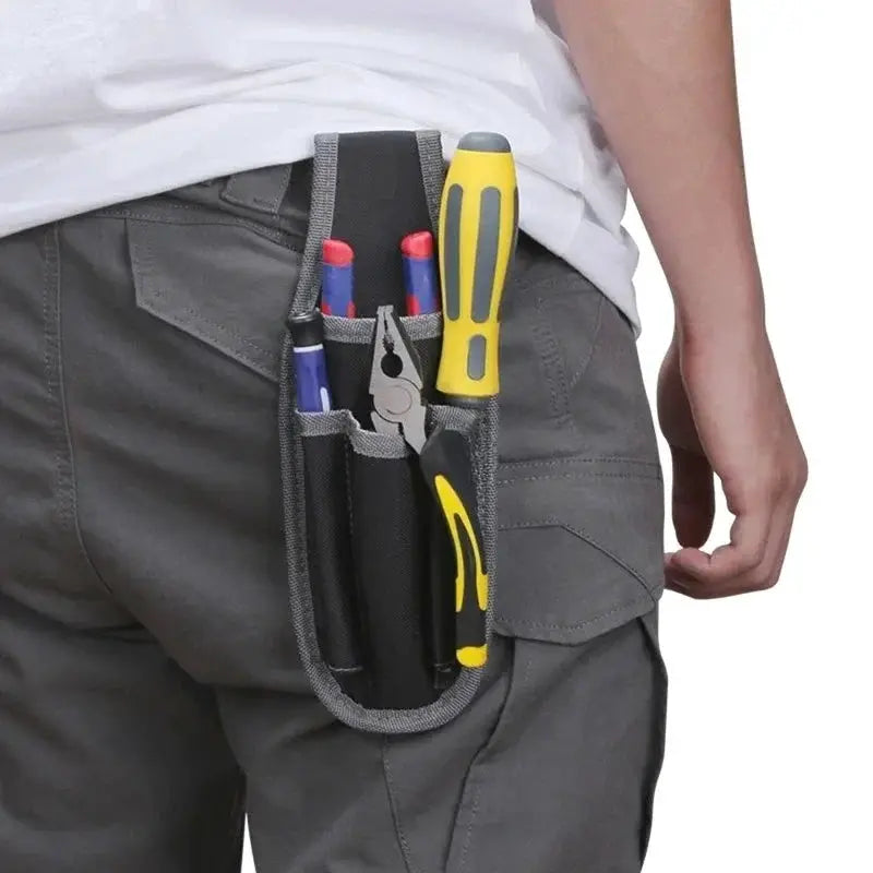 Small portable hip tool bag by Simples Market in dark gray polyester with visible pliers and screwdrivers