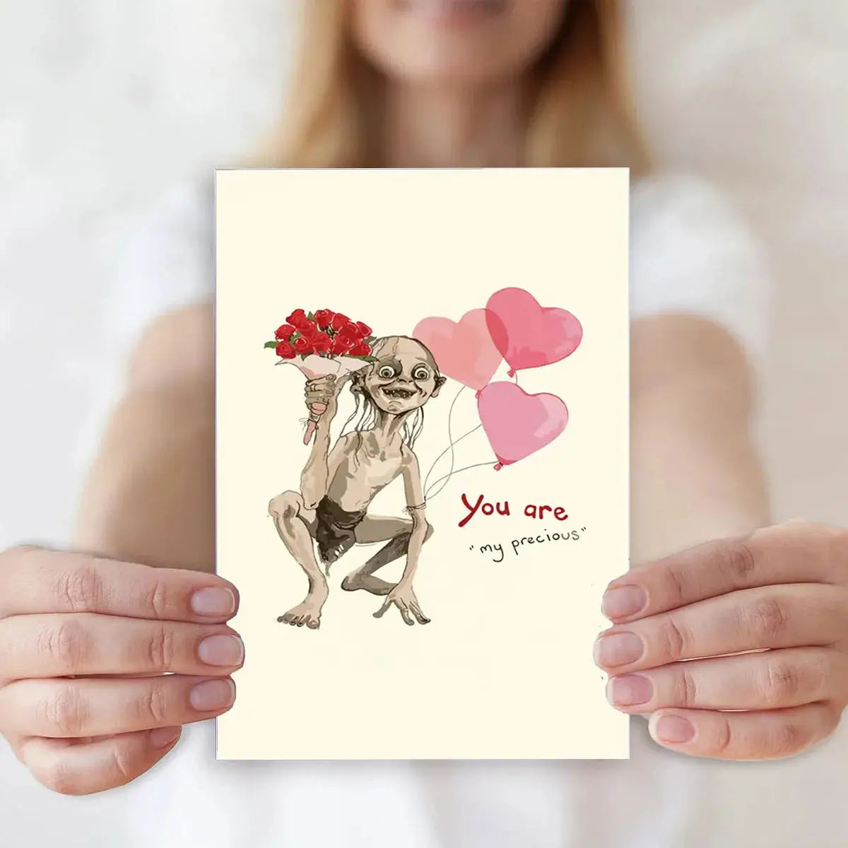 Valentine's Day greeting card with envelope featuring a goblin-like figure holding a bouquet of red roses and heart balloons.