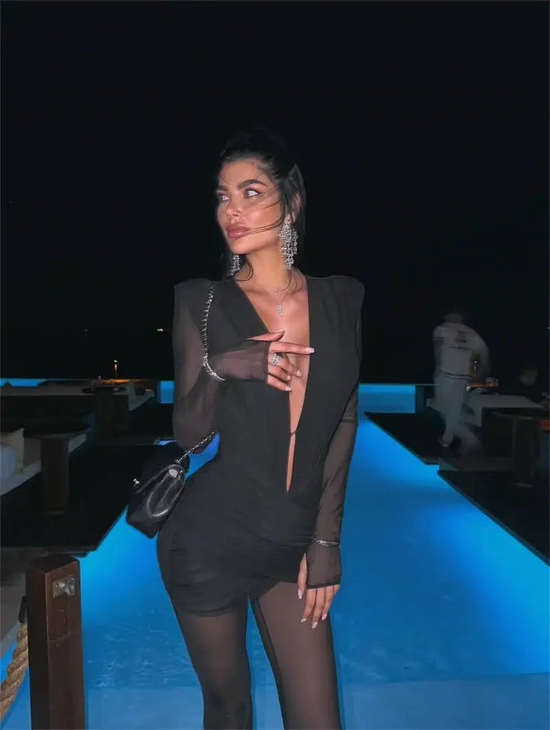 Mozision deep V-neck long-sleeve jumpsuit, black with sheer sleeves and ruched bodice