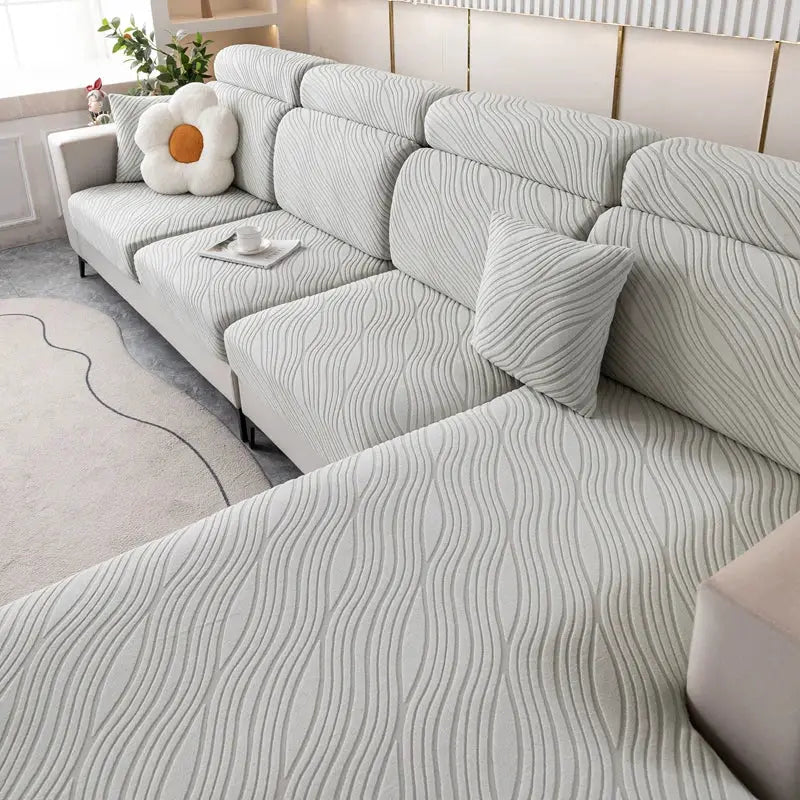 Simples Market sofa cover with elastic fit, light gray wave-pattern plush fabric, removable pet protector.