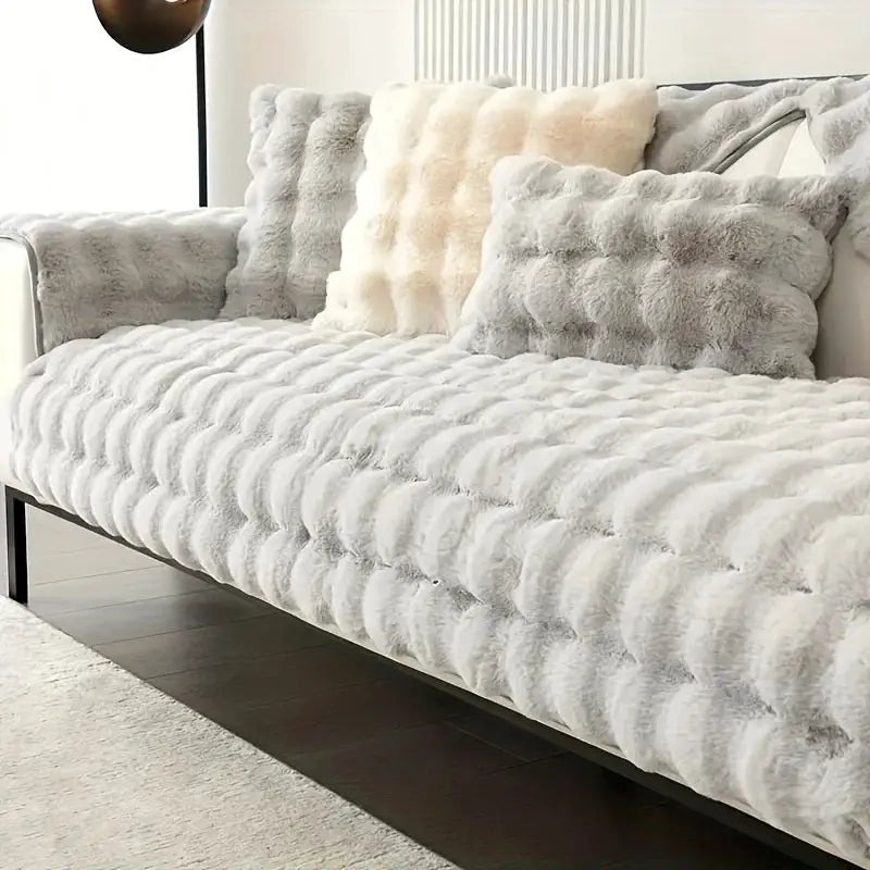 Thick faux rabbit fur sofa slipcover in white with non-slip backing by Simples Market for modern living room