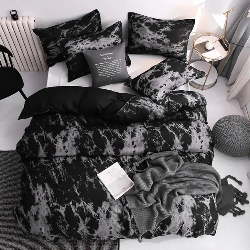 3-piece black and gray marble duvet cover set with pillowcases on a bed