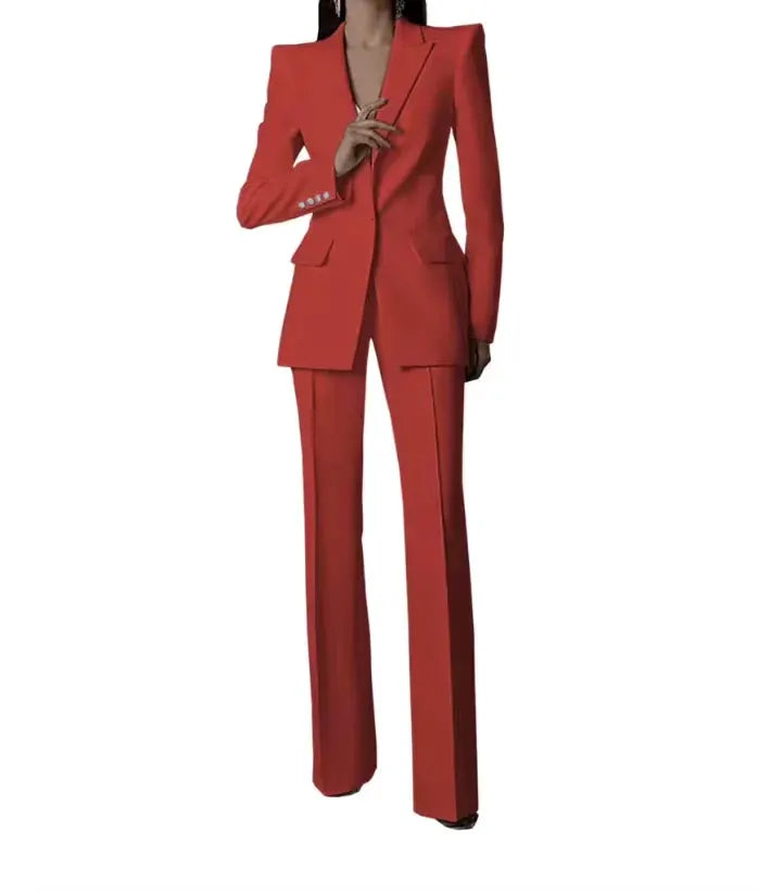 Red women's two-piece pantsuit with single-button blazer and matching wide-leg pants, tailored fit.